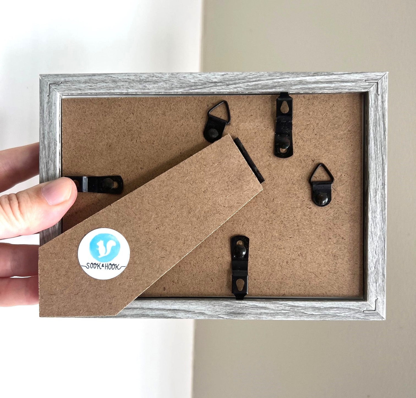 Original sea glass artwork featuring a beautiful watercolor crescent moon and a frosty piece of cobalt blue glass. Artwork is displayed in a 4"x6" shadowbox frame.