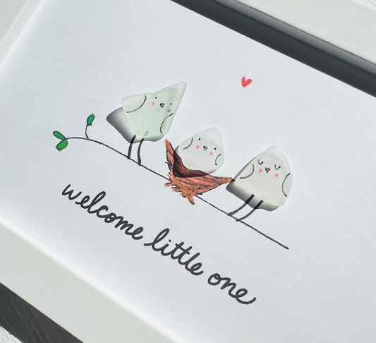 Framed 'Welcome Baby' Sea Glass Art featuring a baby bird watercolor print with genuine sea glass accents, presented in a 4"x 6" white frame.